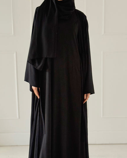 black sleeveless slip dress