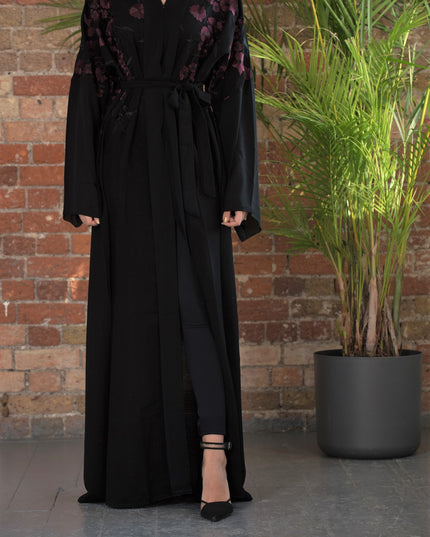 Aaliya Collections A classic black abaya with contrasting burgundy floral embroidery