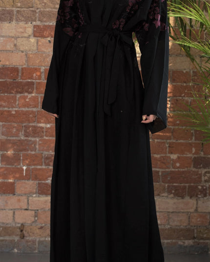 Aaliya Collections A classic black abaya with contrasting burgundy floral embroidery